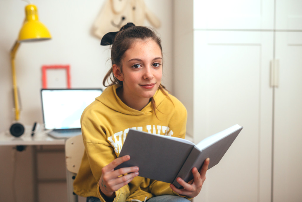 Teenager reading a book