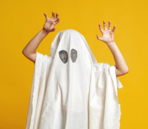 Kid in ghost costume
